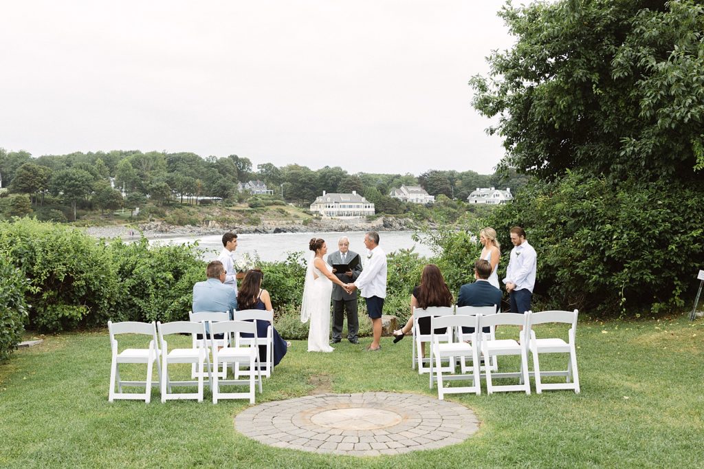 New England wedding held in a garden next to the water