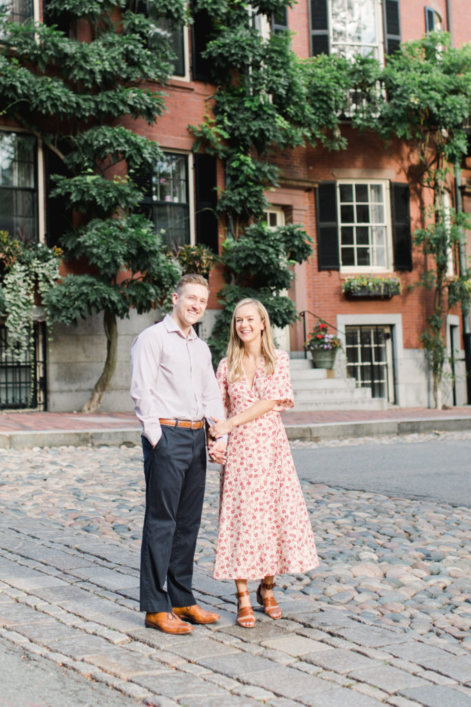 Urban fall engagement photos with a couple wearing bright, dressy clothing