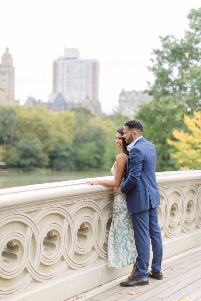 Couple embraces for their Central Park engagement photos