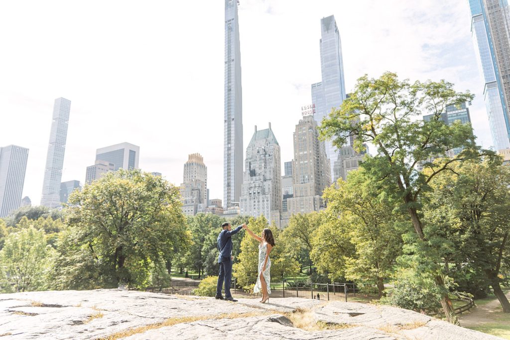 Engagement photos in Central Park with the cityscape in the background