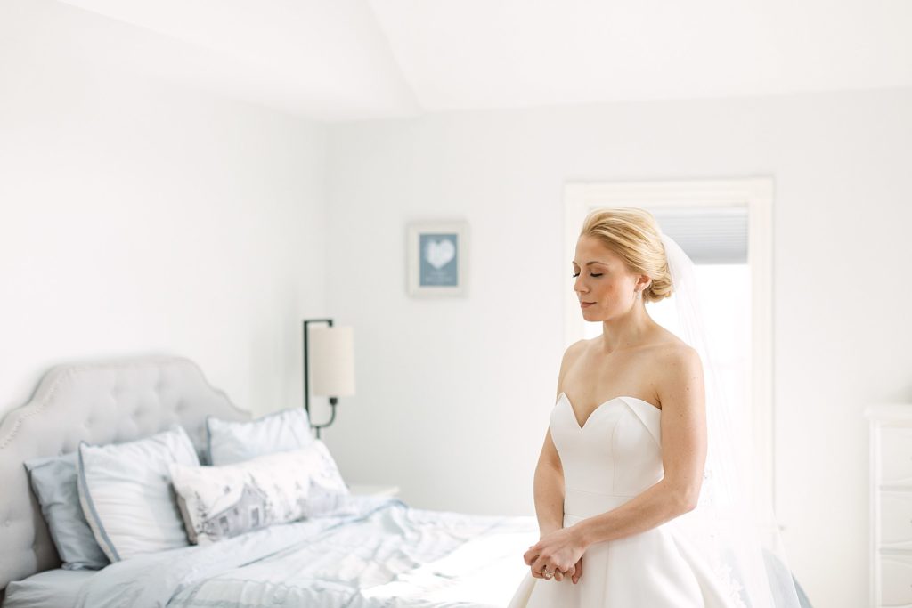 Bride prays in her room before getting married