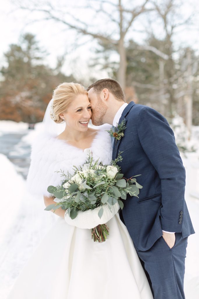 Winter wedding in Massachusetts with a couple posing
