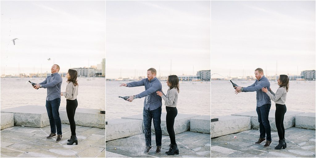 Boston North End engagement session with couple popping the champagne 